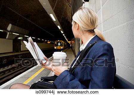 Businesswoman waiting for London Overground train View Large Photo Image Stock Image - Businesswoman waiting for London Overground train. Fotosearch