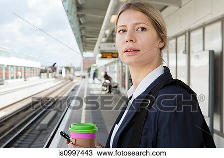 Businesswoman waiting in train station View Large Photo Image Stock Image - Businesswoman waiting in train station. Fotosearch