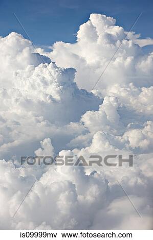 Stock Photo - Cloudscape against blue sky. Fotosearch