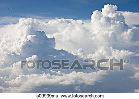 Stock Photograph - Cloudscape against blue sky. Fotosearch