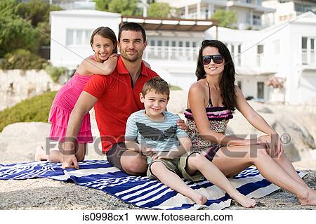 Family sitting having a holiday photograph taken View Large Photo Image Stock Image - Family sitting having a holiday photograph taken. Fotosearch