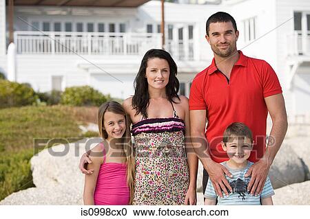 Family standing together for holiday group photo View Large Photo Image Stock Image - Family standing together for holiday group photo. Fotosearch