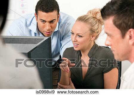 Female employee asking male colleague a question View Large Photo Image Stock Photo - Female employee asking male colleague a question. Fotosearch
