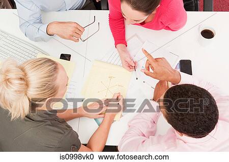 Four people in an informal meeting View Large Photo Image Stock Image - Four people in an informal meeting. Fotosearch