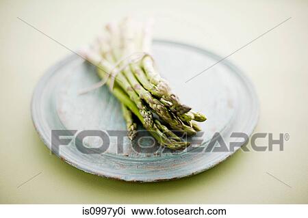 Fresh asparagus tied with string View Large Photo Image Stock Image - Fresh asparagus tied with string. Fotosearch