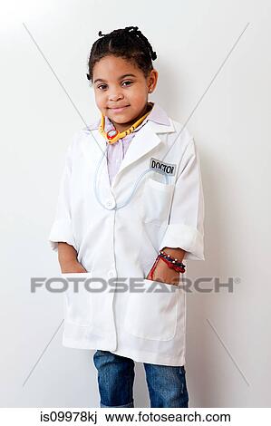 Girl dressing up as doctor View Large Photo Image Stock Image - Girl dressing up as doctor. Fotosearch