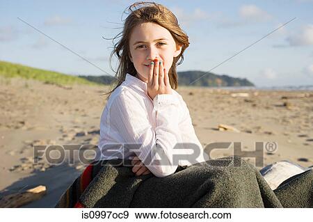 Girl sitting in blanket at beach View Large Photo Image Stock Photo - Girl sitting in blanket at beach. Fotosearch