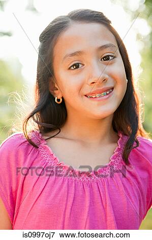 Stock Photo - Girl smiling, portrait. Fotosearch