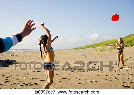 Girls playing on beach View Large Photo Image Stock Photo - Girls playing on beach. Fotosearch