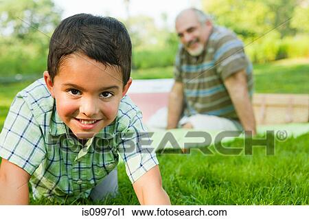 Grandson smiling in park, portrait View Large Photo Image Stock Image - Grandson smiling in park, portrait. Fotosearch