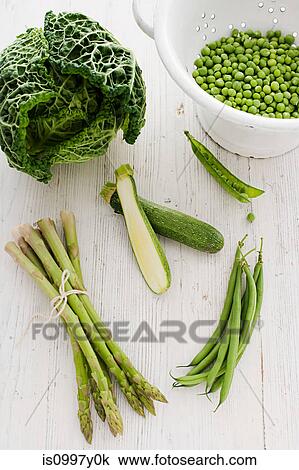 Green vegetables with peas, courgette, asparagus, cabbage and green beans View Large Photo Image Stock Image - Green vegetables with peas, courgette, asparagus, cabbage and green beans. Fotosearch