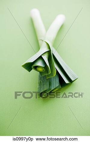 Stock Photography - Leeks against green background. Fotosearch