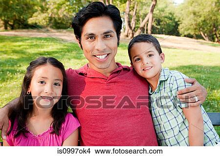 Man with son and daughter in park, portrait View Large Photo Image Picture - Man with son and daughter in park, portrait. Fotosearch