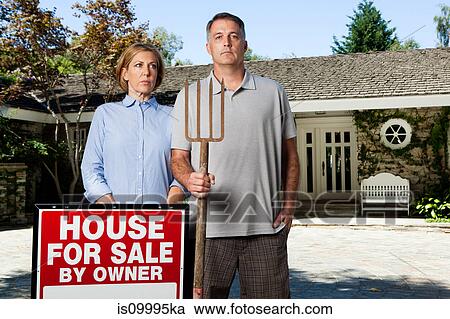 Mature couple standing outside newly bought property in style of American Gothic View Large Photo Image Stock Image - Mature couple standing outside newly bought property in style of American Gothic. Fotosearch