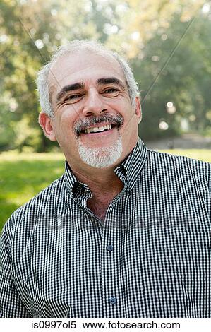 Stock Photography - Mature man smiling, portrait. Fotosearch