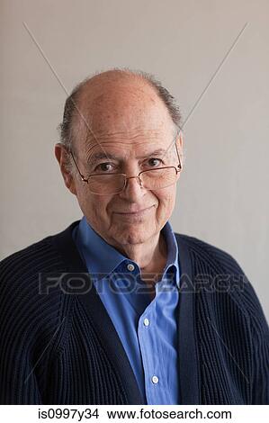 Portrait of a senior man in cardigan and glasses View Large Photo Image Picture - Portrait of a senior man in cardigan and glasses. Fotosearch