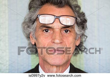 Portrait of a senior man with glasses on forehead View Large Photo Image Stock Photo - Portrait of a senior man with glasses on forehead. Fotosearch