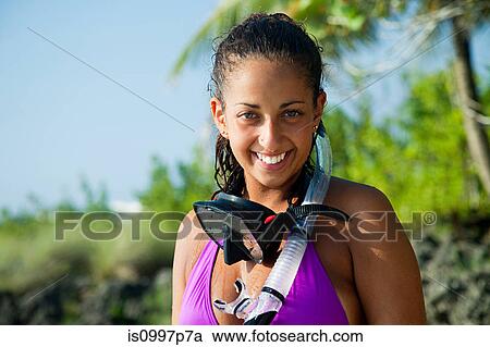 Portrait of young woman wearing diving mask, smiling View Large Photo Image Stock Image - Portrait of young woman wearing diving mask, smiling. Fotosearch