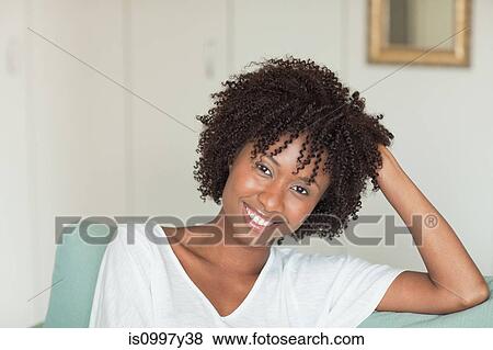 Stock Photo - Relaxed portrait of a young woman. Fotosearch