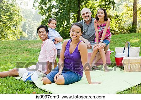 Three generation family at picnic in park, portrait View Large Photo Image Stock Image - Three generation family at picnic in park, portrait. Fotosearch
