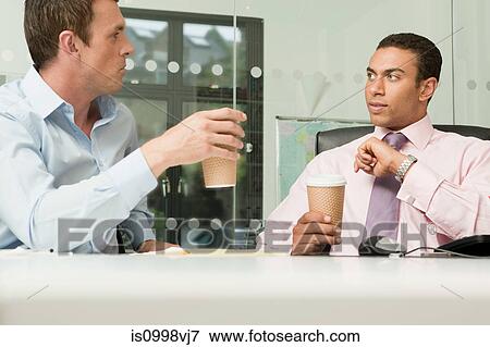 Two business men having an informal meeting View Large Photo Image Stock Photo - Two business men having an informal meeting. Fotosearch