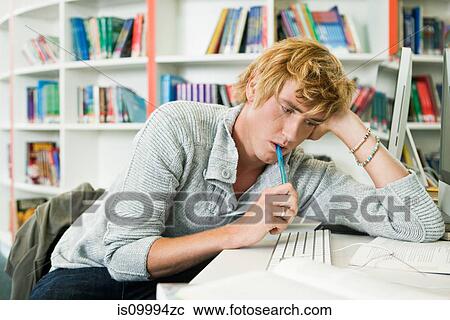 University student leaning on desk View Large Photo Image Stock Image - University student leaning on desk. Fotosearch