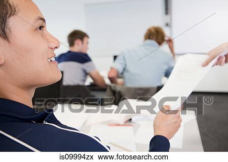 University student receiving exam paper View Large Photo Image Stock Photo - University student receiving exam paper. Fotosearch