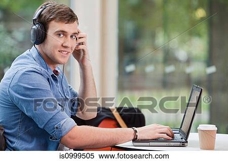 University student working on laptop, portrait View Large Photo Image Stock Photography - University student working on laptop, portrait. Fotosearch