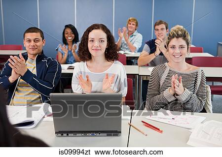 Stock Photograph - University students applauding in class. Fotosearch