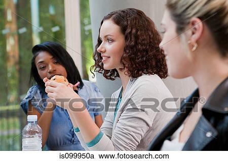 Stock Image - University students in college cafe. Fotosearch