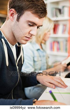 Stock Photo - University students in college library. Fotosearch