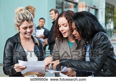 Stock Image - University students receiving their exam results. Fotosearch