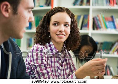 University students smiling in classroom View Large Photo Image Stock Photograph - University students smiling in classroom. Fotosearch