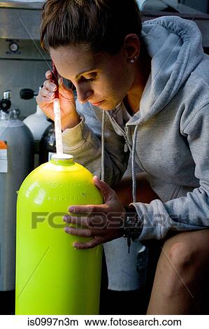 Visual inspection of scuba tank View Large Photo Image Picture - Visual inspection of scuba tank. Fotosearch