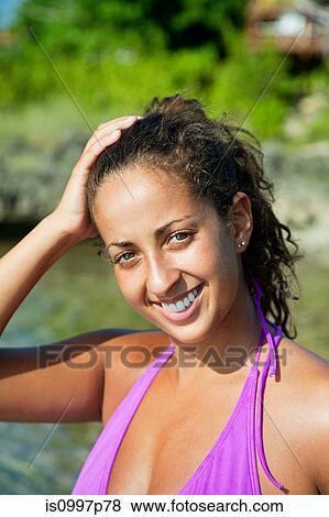 Young woman in bikini, smiling View Large Photo Image Stock Photo - Young woman in bikini, smiling. Fotosearch