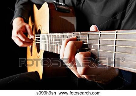 Close up of person playing classical guitar View Large Photo Image Picture - Close up of person playing classical guitar. Fotosearch