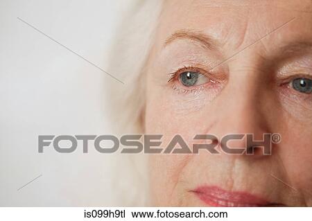 Stock Image - Close up of senior woman looking away. Fotosearch
