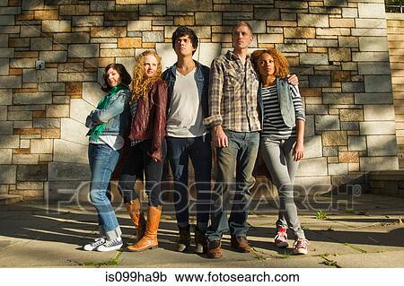 Five friends standing together in park View Large Photo Image Stock Image - Five friends standing together in park. Fotosearch
