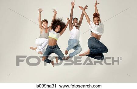 Four young adults jumping in the air with joy View Large Photo Image Stock Image - Four young adults jumping in the air with joy. Fotosearch