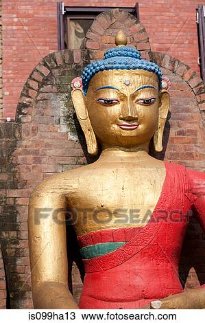 Stock Image - Golden Buddha statue, Nepal. Fotosearch