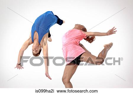 Man doing a somersault with woman jumping View Large Photo Image Stock Image - Man doing a somersault with woman jumping. Fotosearch