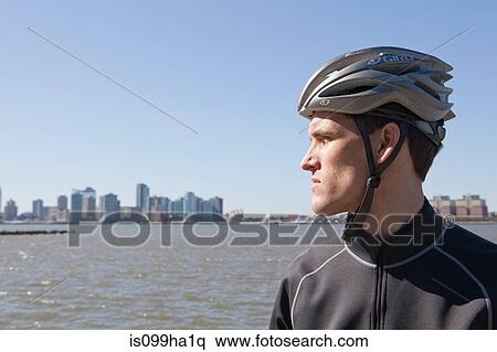 Man in cycling gear looking at view View Large Photo Image Stock Photography - Man in cycling gear looking at view. Fotosearch