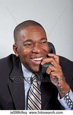 Mature businessman using telephone, smiling View Large Photo Image Stock Photography - Mature businessman using telephone, smiling. Fotosearch
