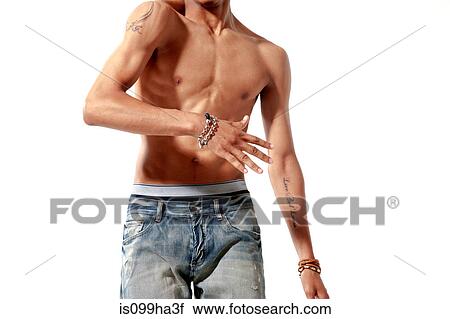 Mid section of bare chested young adult man View Large Photo Image Stock Image - Mid section of bare chested young adult man. Fotosearch