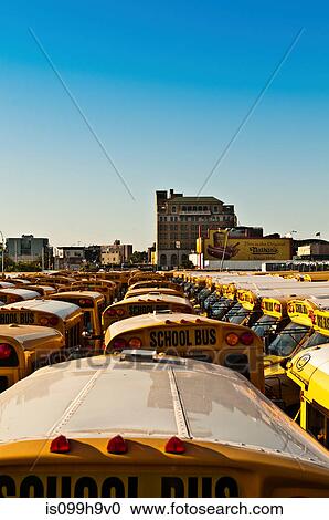 Stock Image - School bus depot, Coney Island, New York, USA. Fotosearch