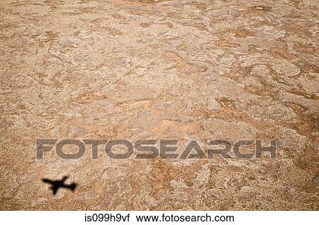 Shadow of a plane flying over Iceland View Large Photo Image Stock Image - Shadow of a plane flying over Iceland. Fotosearch