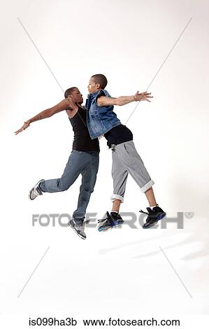Two male rivals in mid air View Large Photo Image Stock Image - Two male rivals in mid air. Fotosearch
