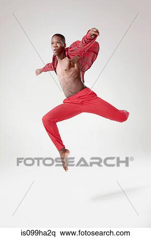 Stock Photography - Young dancer in mid air. Fotosearch