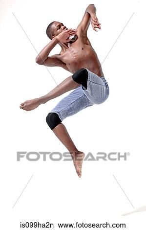 Picture - Young man in mid air. Fotosearch
