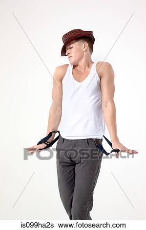 Young man pulling trouser braces View Large Photo Image Stock Photograph - Young man pulling trouser braces. Fotosearch
